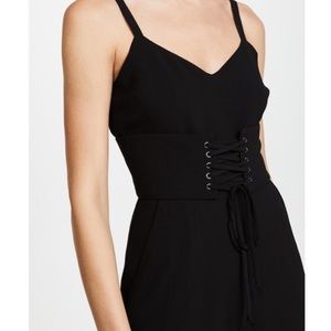 BLACK VCUT JUMPSUIT WITH CORSET BELT